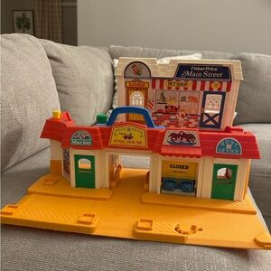 Fisher-Price Main Street Playset with Red and Yellow Features